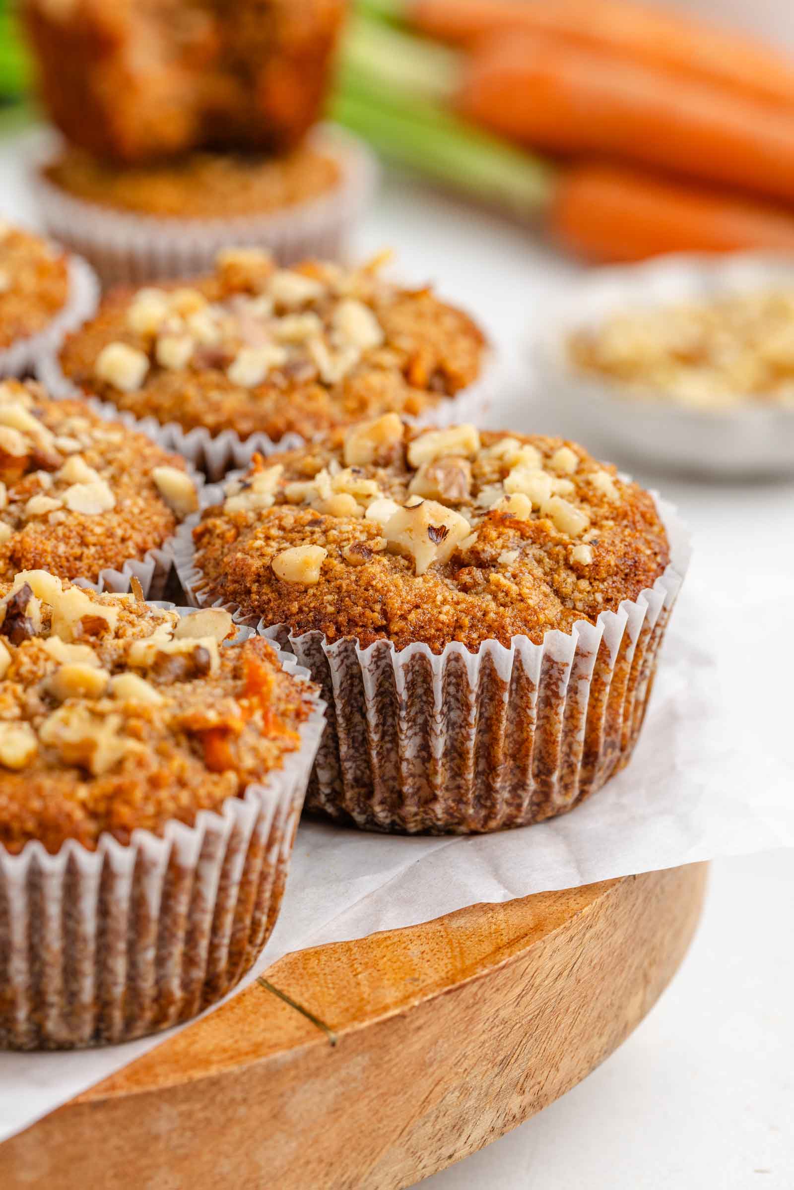 almond flour carrot muffin on a wooden cutting board