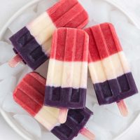 Image of red, white and blue popsicles on a glass plate
