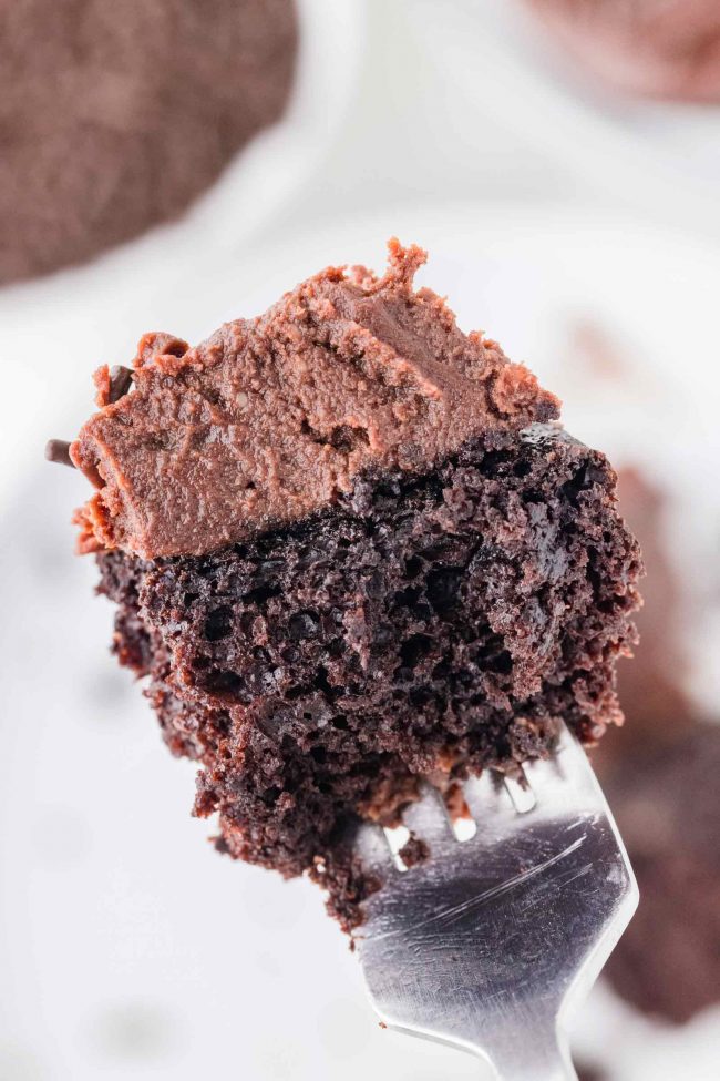 A closeup of an eggless chocolate cupcake bite on a fork