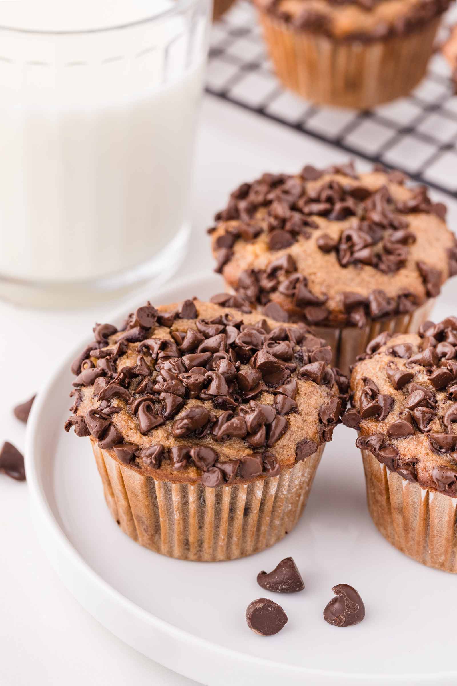 3 eggless banana muffins on a white plate